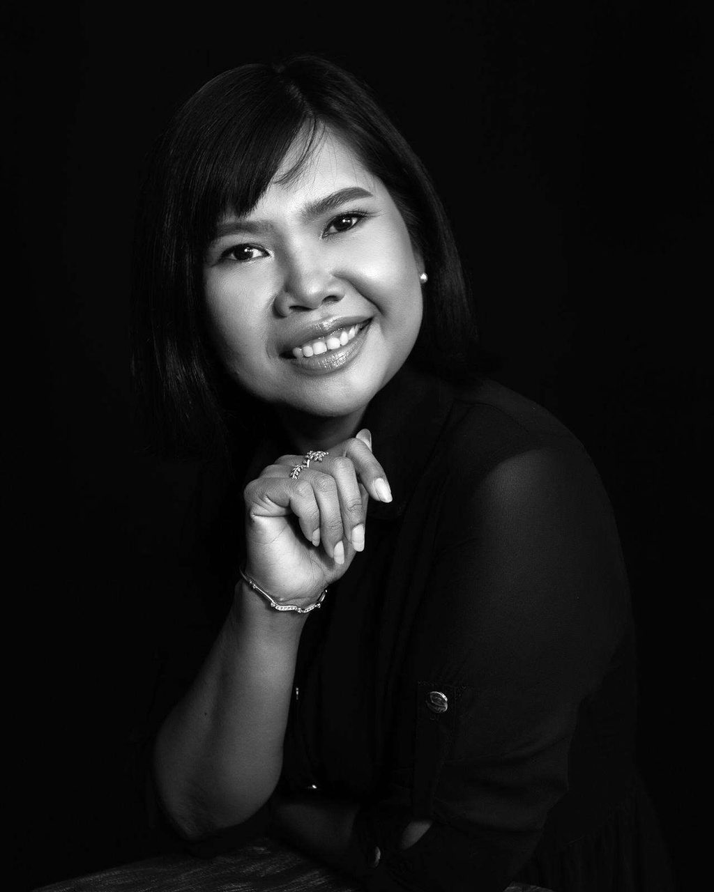 Editorial portrait of Supparin, lead floral designer at Wedding Flowers Phuket
