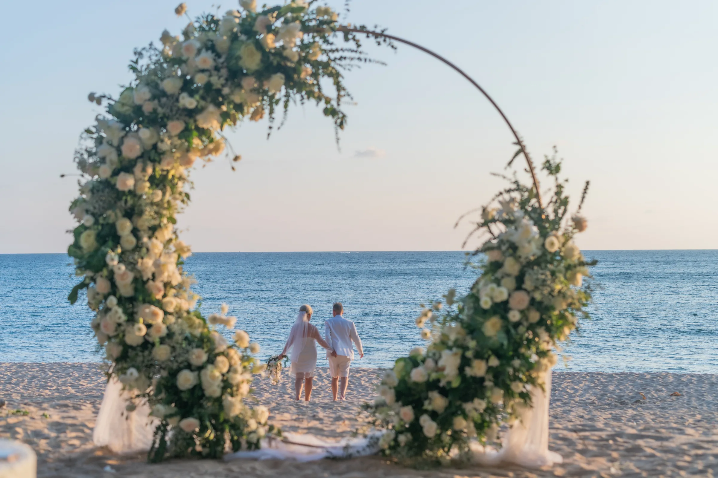Deslie, Russell, Maureen & Peter — Beach Vow Renewal, April 2026 — Phuket wedding florals by Supparin