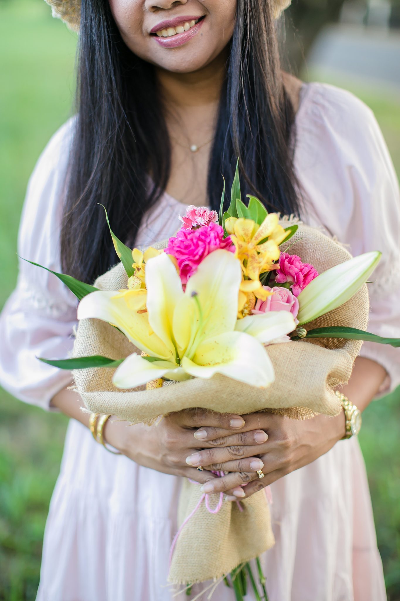 Supparin conditioning fresh flowers in the studio ahead of a Phuket wedding build